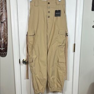 NWT DressMECB khaki pants size medium. Elastic waistband, pockets on legs. Strap